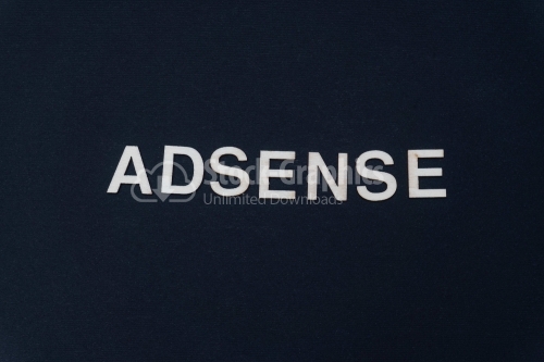 ADSENSE word written on dark paper background. ADSENSE text for your concepts