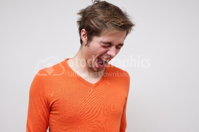 Angry young man screaming