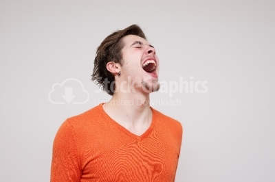 Angry young man screaming