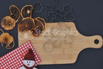 Baking background with dried fruits snow man, and kitchen tools