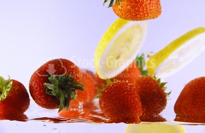 Bubbly Fruit, strawberries and lemon - Stock Image