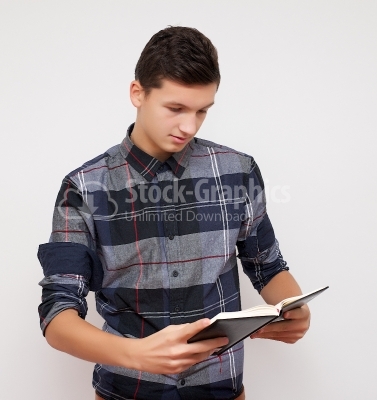 Business young boy reading the notebook