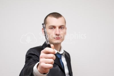 Businessman holding a pen
