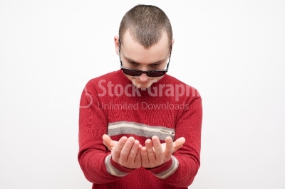 Businessman showing something on the palm of his hand