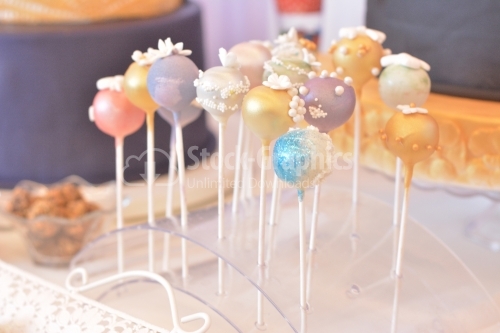 Cake pops with blue, purple and gold glitter