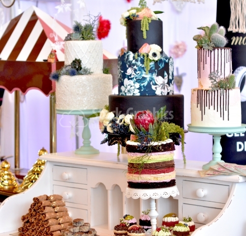 Candy bar with a multitude of cakes on different themes