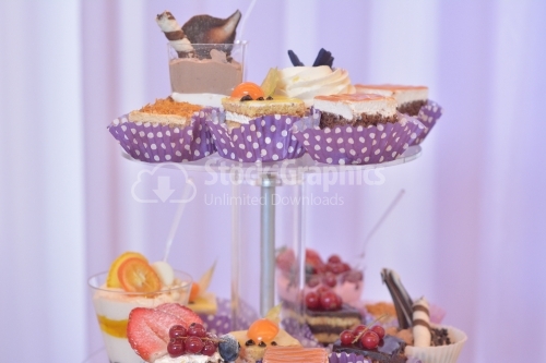 Cream layers cakes and assorted fruits. Candy bar