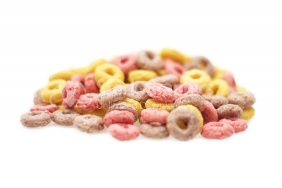 Delicious and nutritious fruit cereal loops flavorful on white background