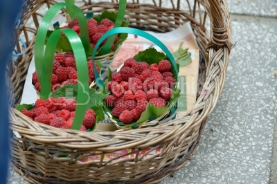 Fresh juicy organic strawberries in wicker basket