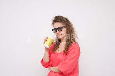 Girl enjoys her cup of tea on white background