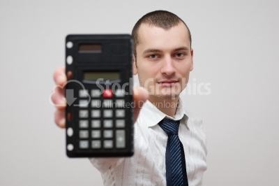 Handsome Young Businessman With Calculator
