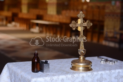 Holy cross and the holy oil, ready for baptism ceremony
