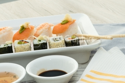 Japan cuisine. Sushi on a gete over wooden background