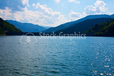 Lake and mountain in reservoir with evening sky and blue sky clo