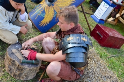 Medieval knight in armor working 