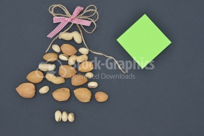 Mixed nuts on dark background looking like Christmas Tree