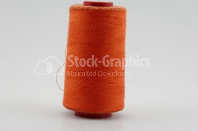 Orange thread in spool