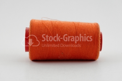 Orange thread in spool