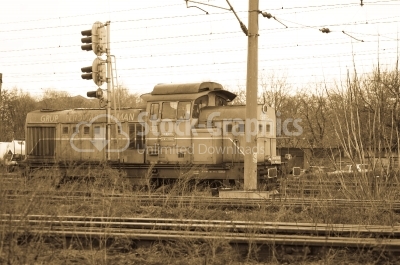 Sepia Locomotive in station. Train of the National Railway Compa