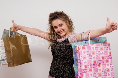 Smiling pretty woman with bags