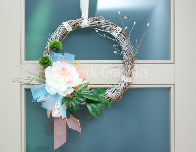 Spring wreath hanged on door