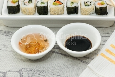 Two white bowls with japanesse souce