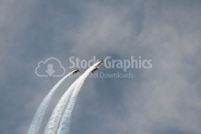 Vapour trail on the cloudy sky 