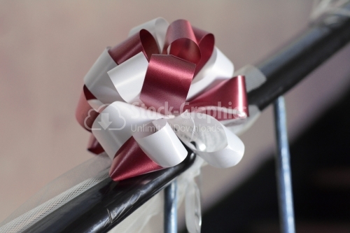 Wedding bow tied up on stairs