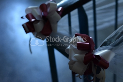 White and rose bows on chair