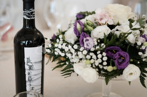 Wine bottle and floral bouquet