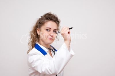 Woman doctor writing something on screen or transparent glass