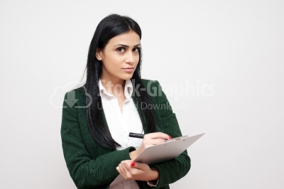 Woman making notes on a clipboard