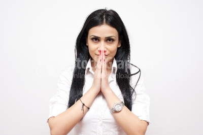 Woman praying holding clasp hands together