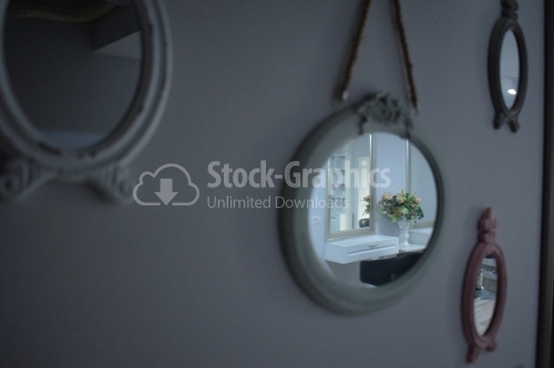 Wooden framed mirror on wall at home