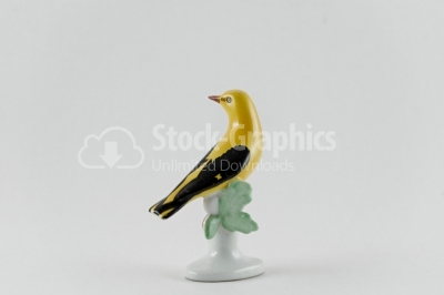 Yellow bird porcelain statue on white Image