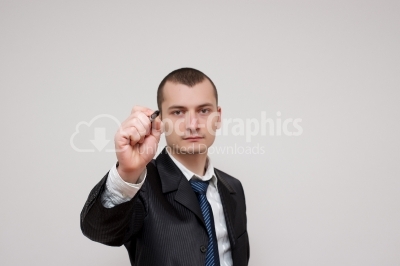 Young businessman drawing on a whiteboard