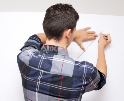 Young businessman is using a ruler - Stock Image