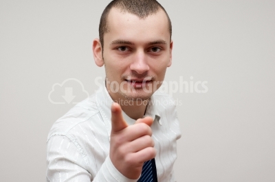 Young businessman pointing at you