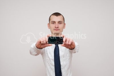 Young businessman Showing his Iphone