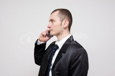Young businessman talking on cellphone