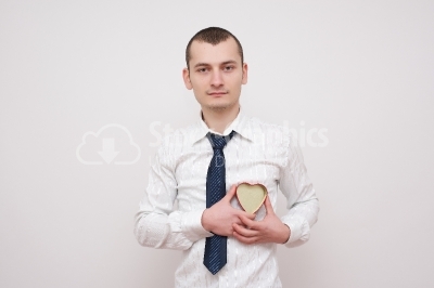 Young businessman with a red heart