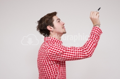 Young guy drawing sideways on a virtual card