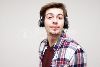 Young handsome man enjoying music 