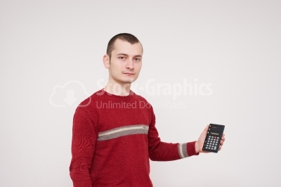 Young man holding a calculator in his hands stock photo