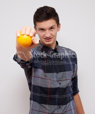 Young man with orange on white