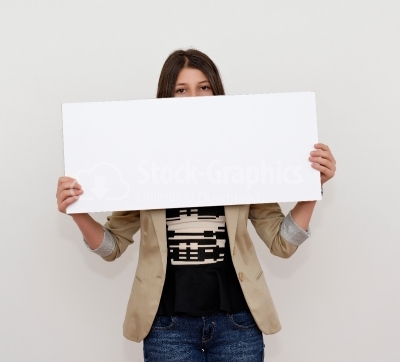 Young woman with an empty sheet of paper half covering face stoc