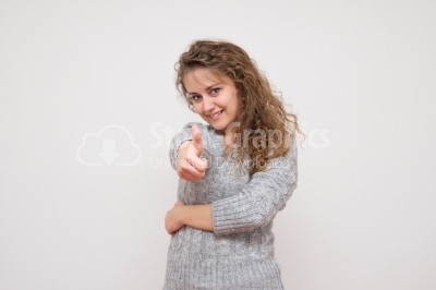  Happy smiling woman with thumbs up gesture, isolated on white b