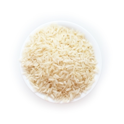 A heap of raw rice isolated on white background, top view