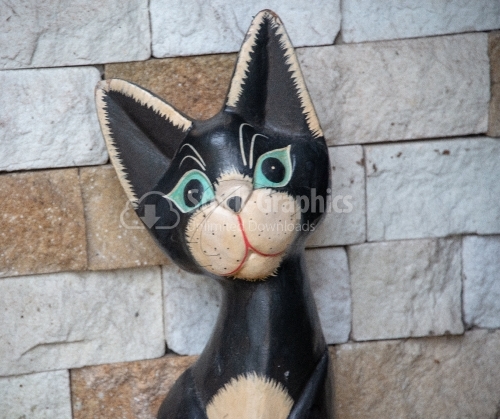 A picture of Lovely dark wood cat