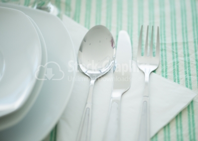 A set of cutlery arranged on table